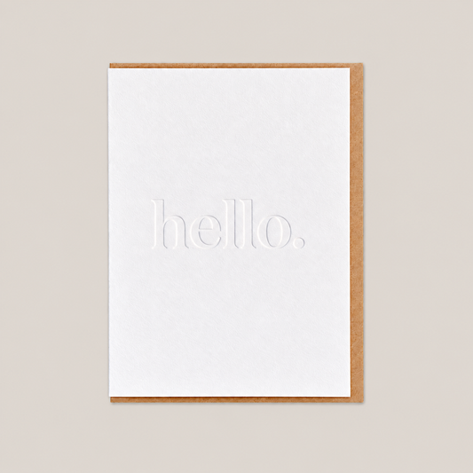 Hello debossed letterpress card on warm greige background