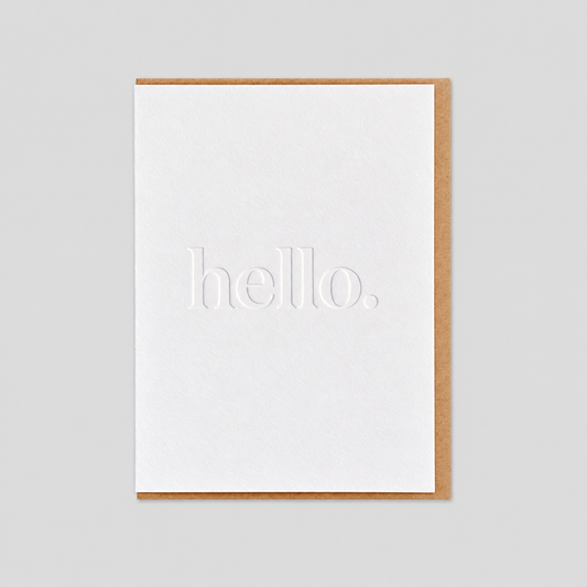 Hello debossed letterpress card on light gray background